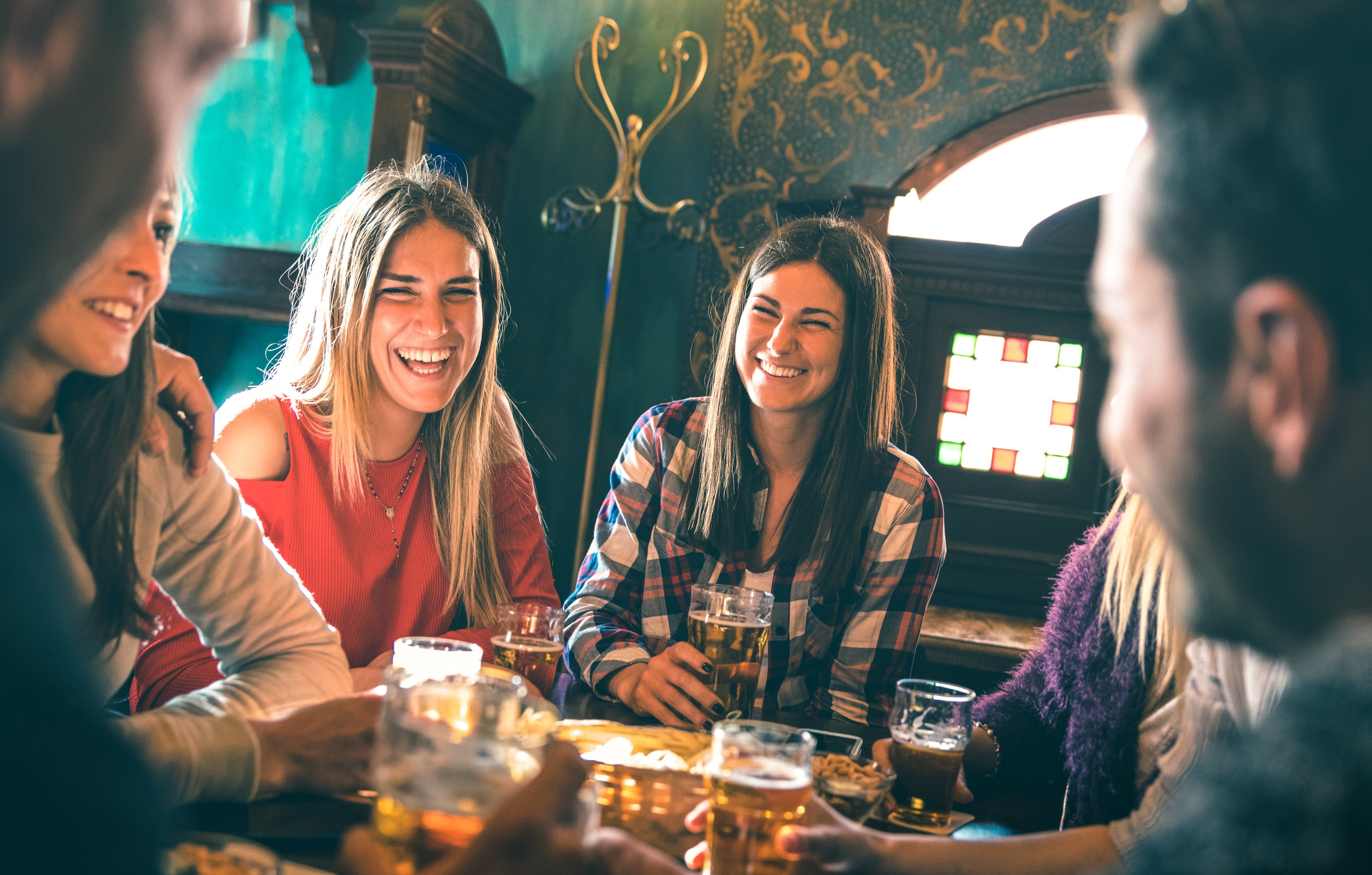 People enjoying drinks together in a bar setting
